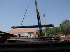 STEEL PIPE IS MOVED BY CRANE